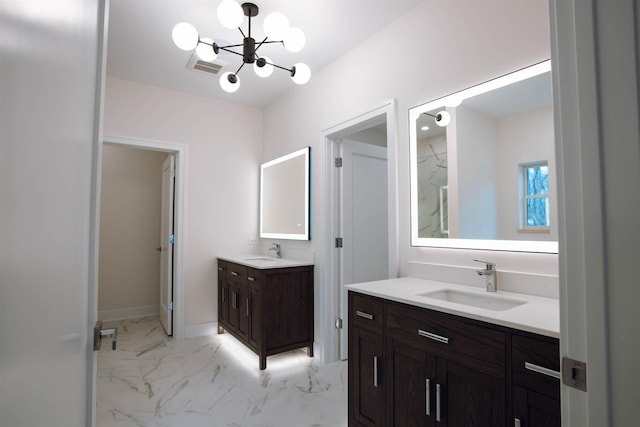 bathroom featuring vanity and a chandelier