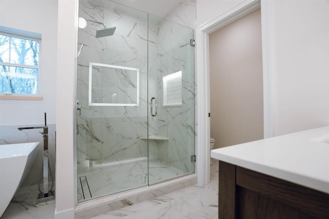 bathroom featuring separate shower and tub and toilet