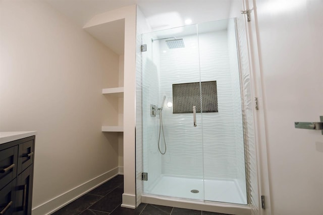 bathroom with tile patterned flooring, vanity, and a shower with shower door