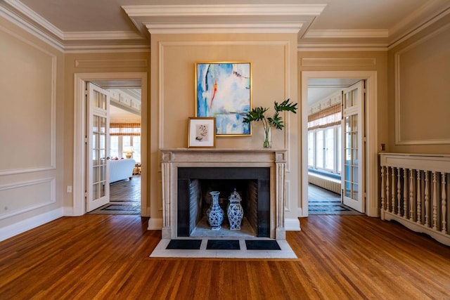 304 Braebourne Ct, Green Bay, WI 54301 - unfurnished living room with wood-type flooring, radiator heating unit, french doors, and crown molding