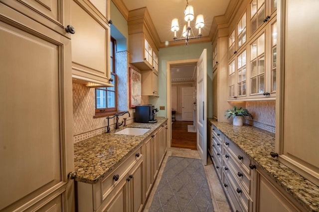 304 Braebourne Ct, Green Bay, WI 54301 - kitchen featuring light stone countertops, sink, pendant lighting, and an inviting chandelier