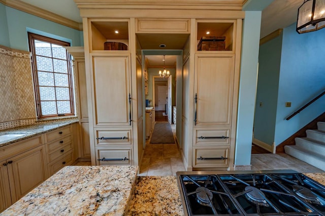 304 Braebourne Ct, Green Bay, WI 54301 - kitchen with light stone counters, a chandelier, decorative light fixtures, and ornamental molding