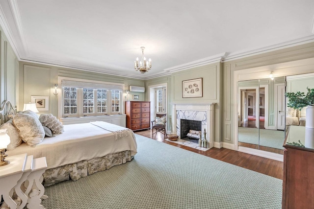 304 Braebourne Ct, Green Bay, WI 54301 - bedroom featuring an inviting chandelier, dark hardwood / wood-style floors, ornamental molding, a premium fireplace, and a wall mounted AC