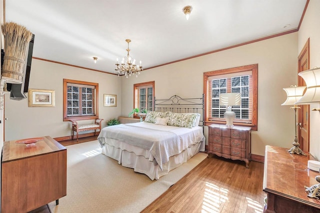 304 Braebourne Ct, Green Bay, WI 54301 - bedroom with light hardwood / wood-style floors, crown molding, and an inviting chandelier