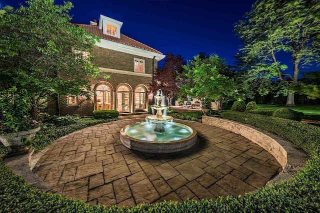 304 Braebourne Ct, Green Bay, WI 54301 - view of patio at twilight