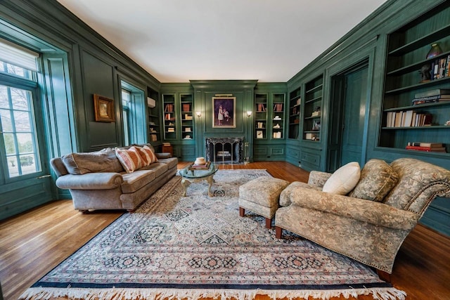304 Braebourne Ct, Green Bay, WI 54301 - living room with crown molding, built in features, and hardwood / wood-style floors