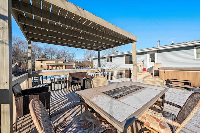 view of patio featuring a deck and a hot tub