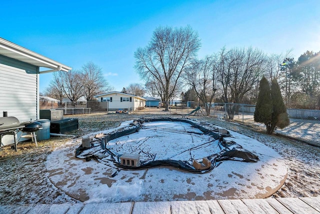 view of yard featuring a covered pool