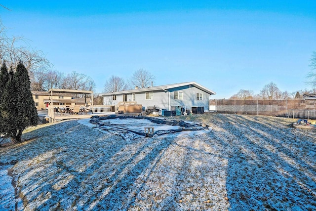 rear view of property with cooling unit