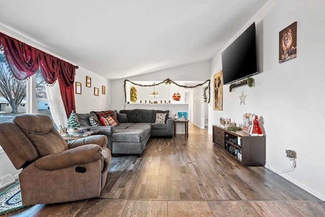 living room featuring hardwood / wood-style floors and vaulted ceiling