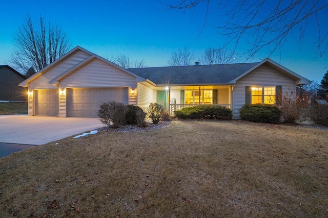 single story home with a garage and a yard