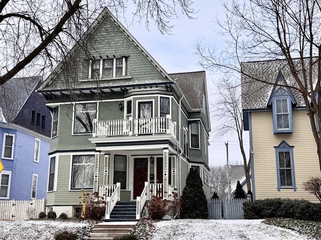 victorian house featuring a balcony