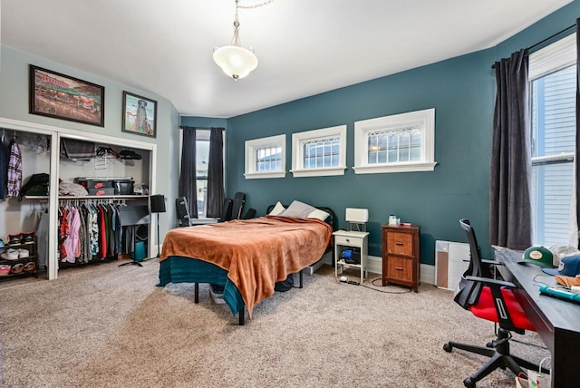 bedroom with carpet and a closet