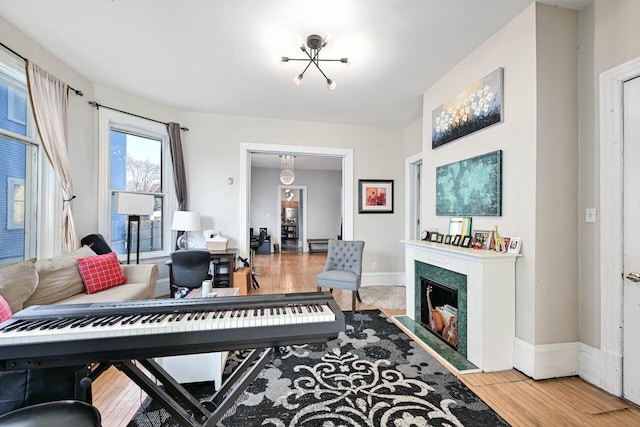 living room with hardwood / wood-style floors and an inviting chandelier