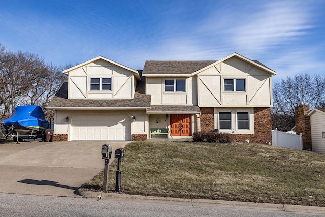 view of front of property featuring a front yard and a garage