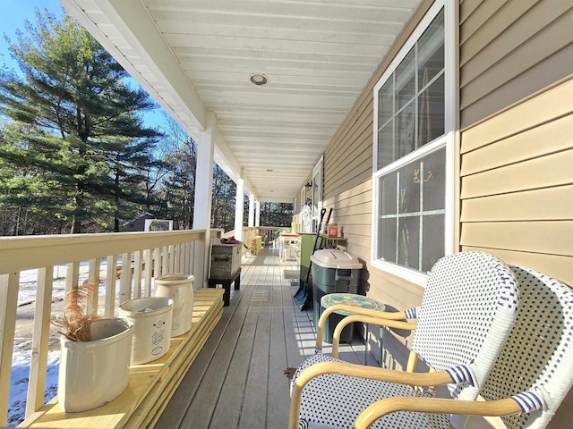 wooden terrace featuring a porch