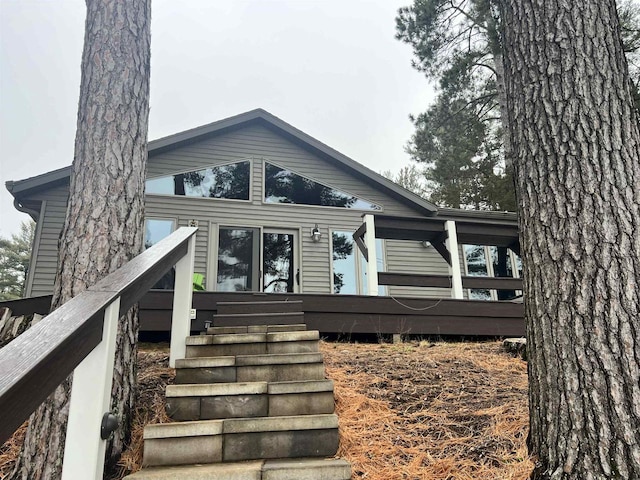 rear view of property with a deck