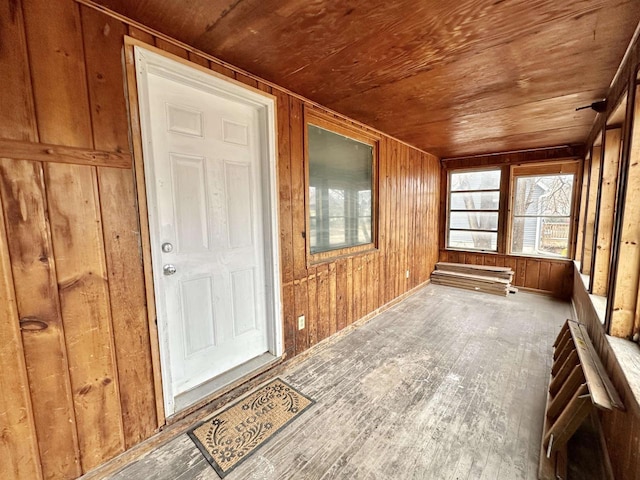 unfurnished sunroom featuring wooden ceiling