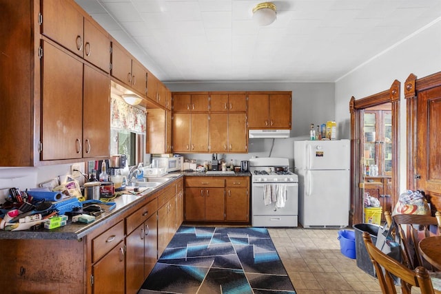 kitchen with white appliances and sink