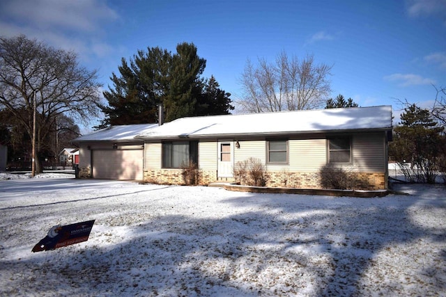 single story home with a garage