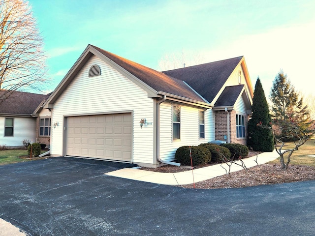 view of property exterior featuring a garage