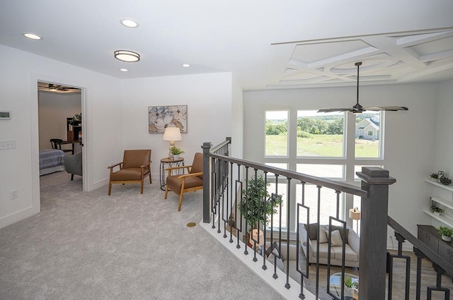 corridor with beam ceiling, light carpet, and coffered ceiling