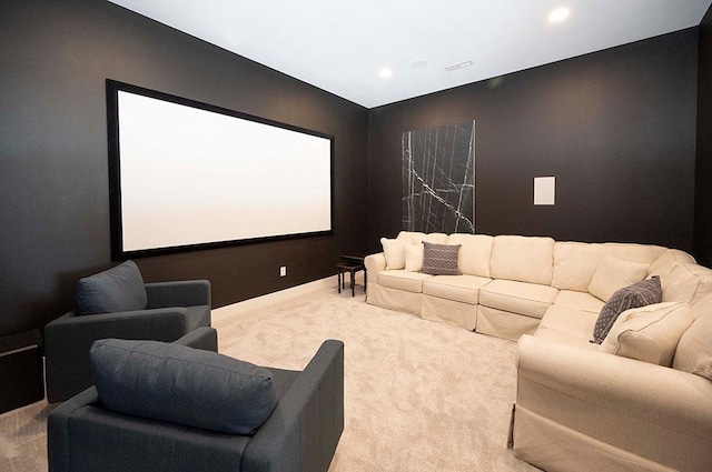 cinema room featuring carpet flooring