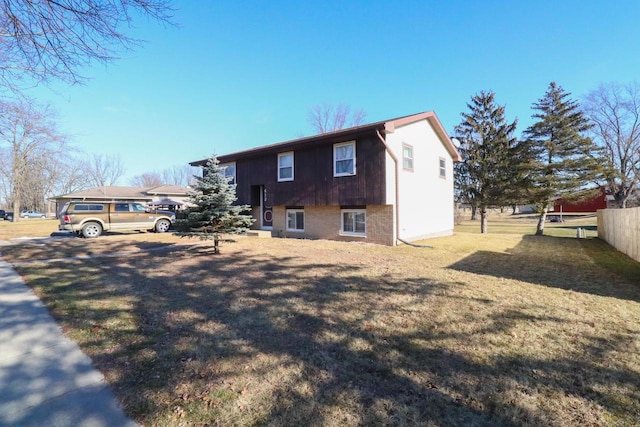 view of home's exterior featuring a yard