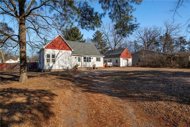 back of property with an outdoor structure