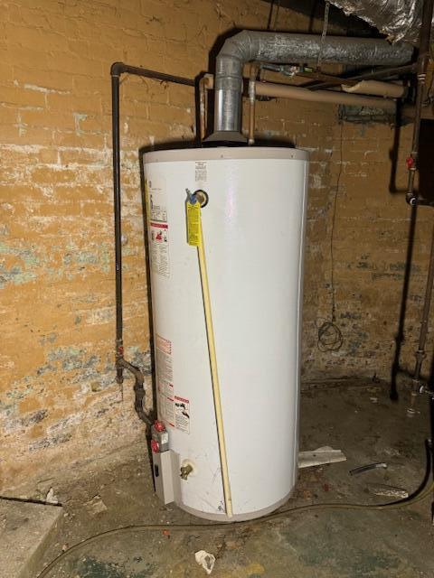 utility room with water heater