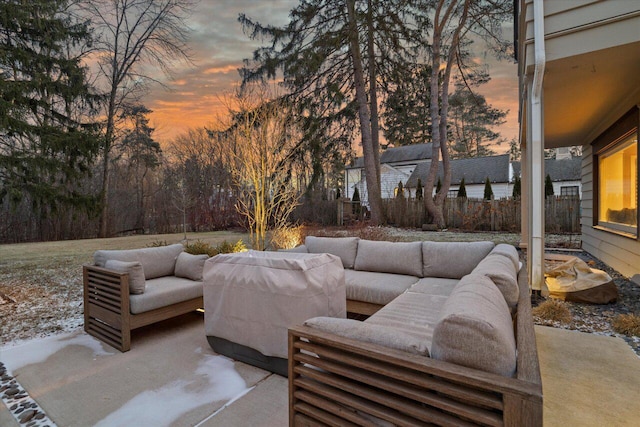 patio terrace at dusk featuring outdoor lounge area