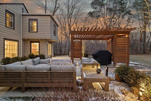 patio terrace at dusk with an outdoor living space, grilling area, and a pergola