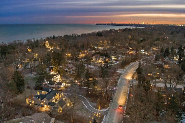 aerial view at dusk with a water view