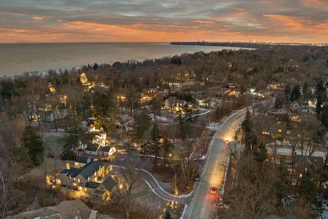 aerial view at dusk with a water view