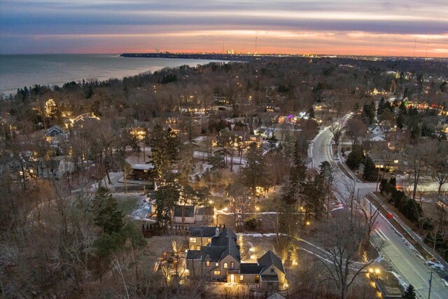 aerial view at dusk with a water view