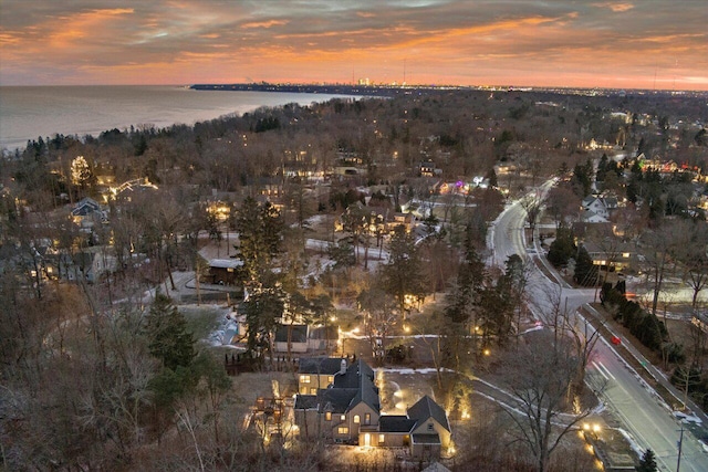 aerial view at dusk with a water view