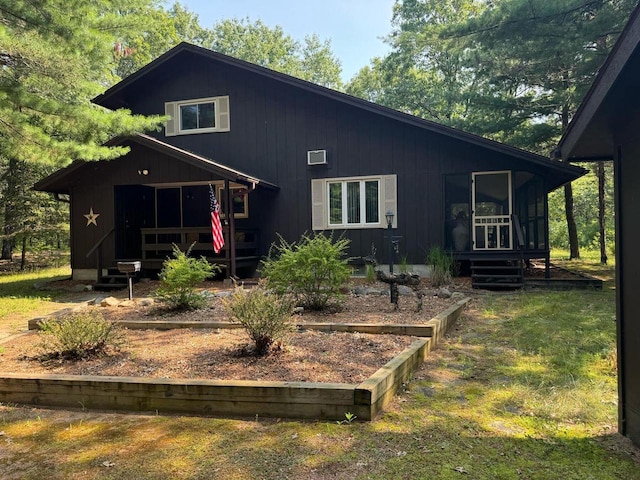 back of house featuring a sunroom