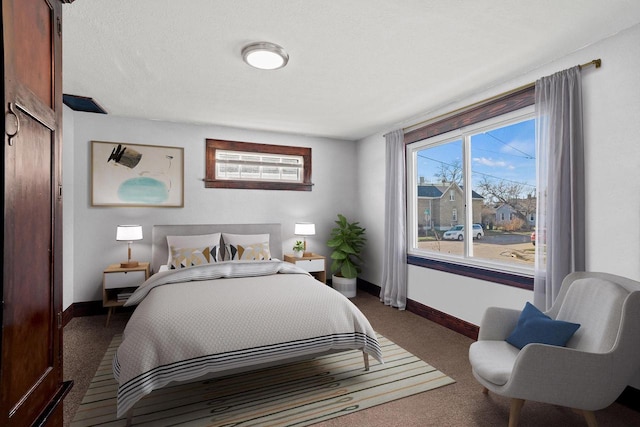 bedroom featuring dark colored carpet