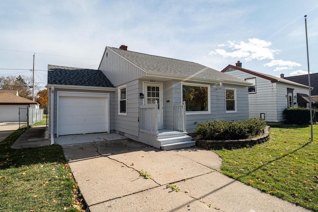 ranch-style home with a front yard and a garage