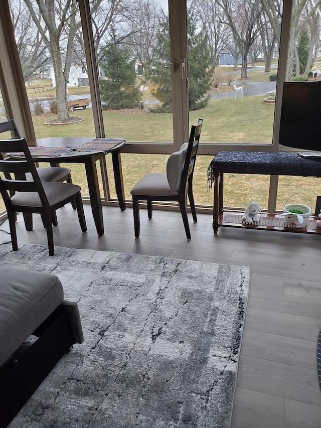 sunroom / solarium featuring plenty of natural light