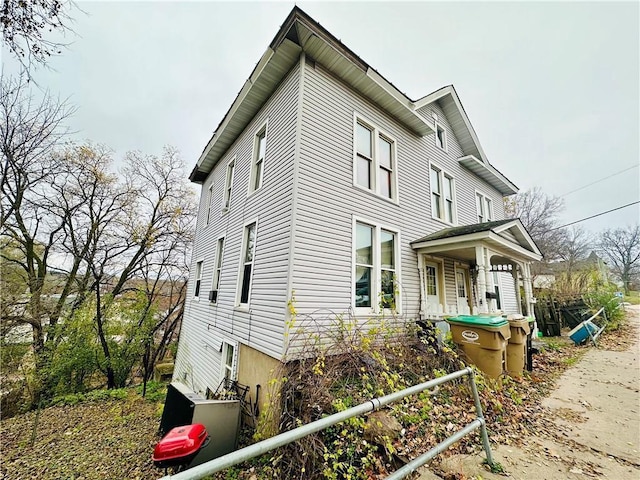 view of property exterior with covered porch