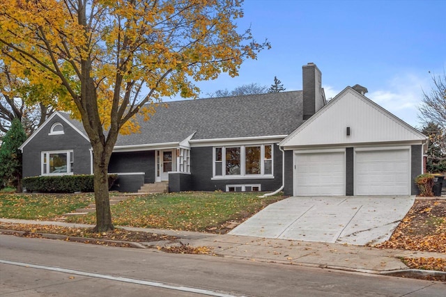 ranch-style home featuring a garage and a front yard