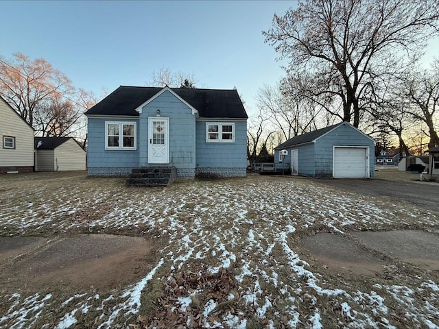 view of front of house featuring an outdoor structure and a garage