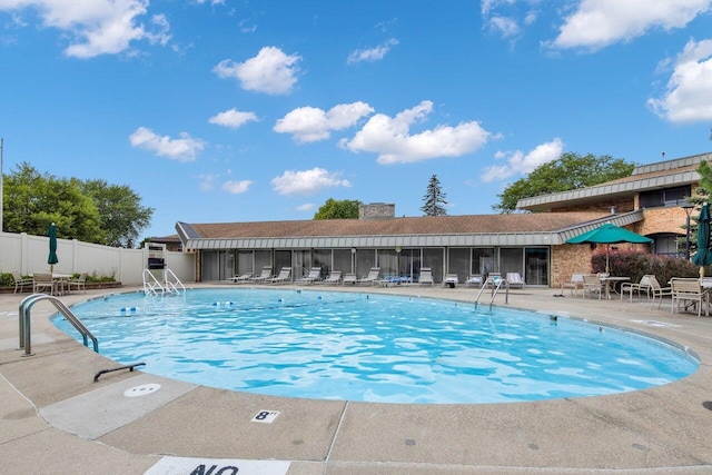 view of swimming pool with a patio