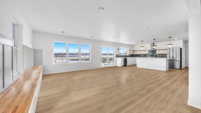 unfurnished living room with light hardwood / wood-style flooring