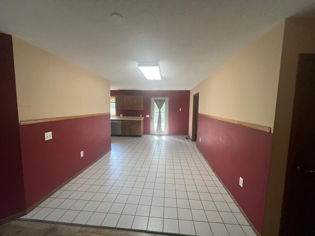 tiled empty room with french doors