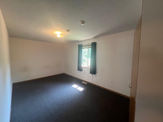 spare room featuring a textured ceiling