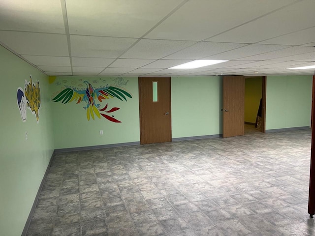 basement featuring a drop ceiling