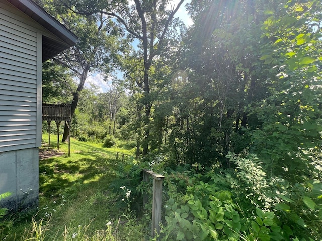 view of yard featuring a wooden deck