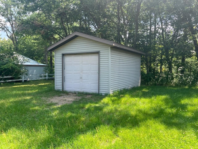 garage with a lawn